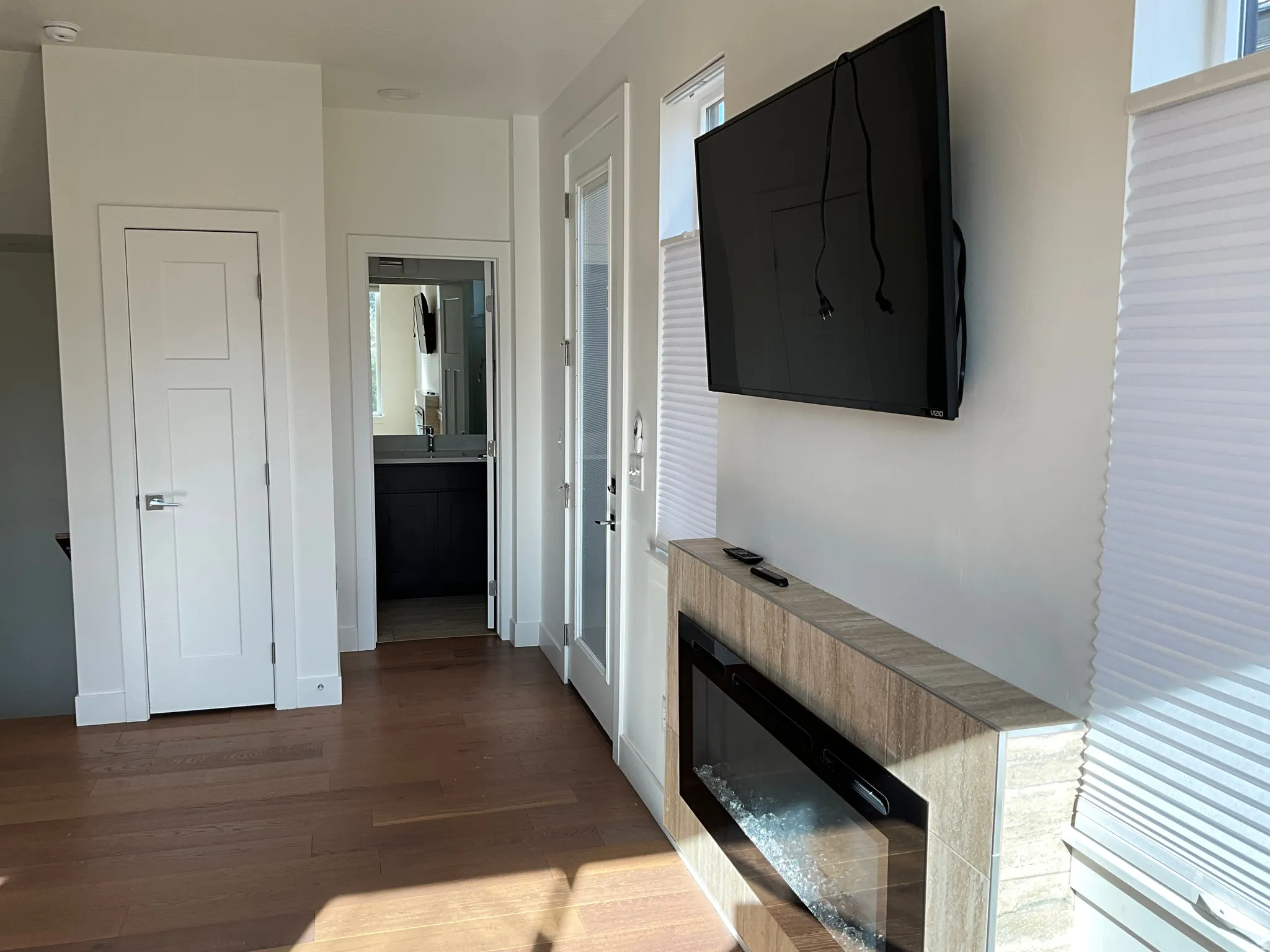 Hallway featuring dark wood-style flooring