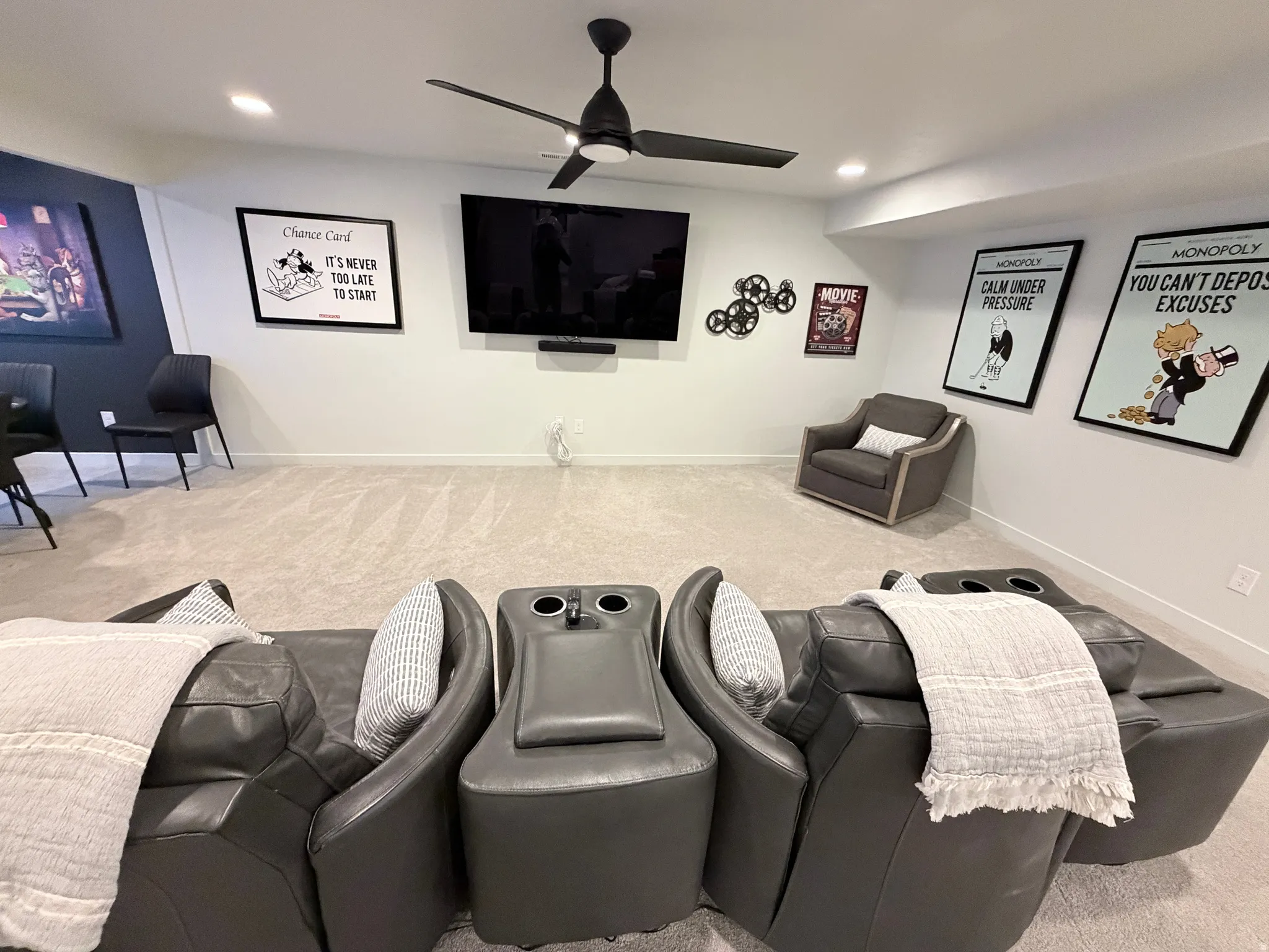Carpeted, ceiling fan, electric theater chairs, Large TV