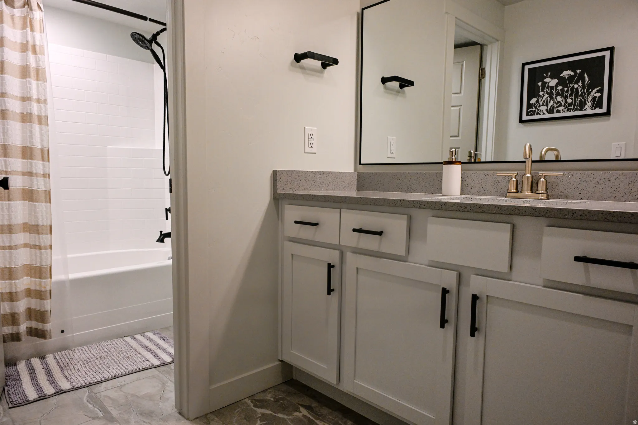 Basement Full Bathroom featuring vanity and shower / tub combo