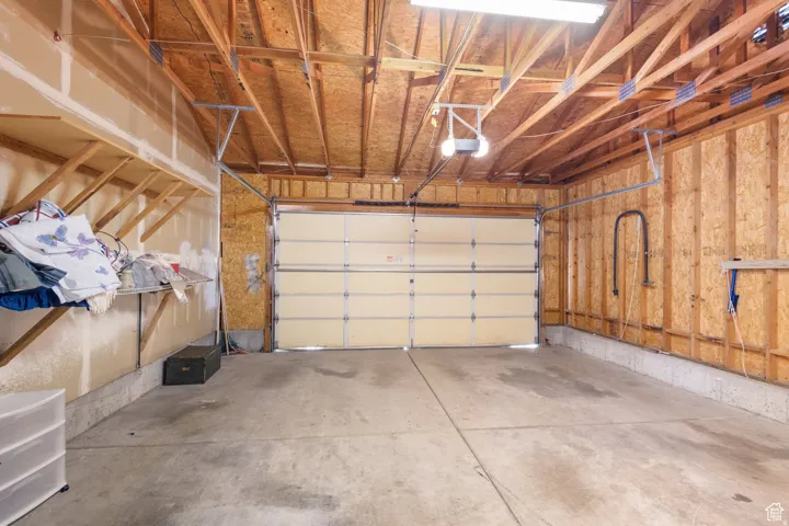Garage featuring a garage door opener