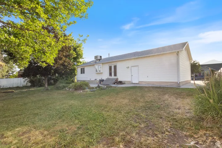 Rear view of property with a patio area, french doors, and entry steps