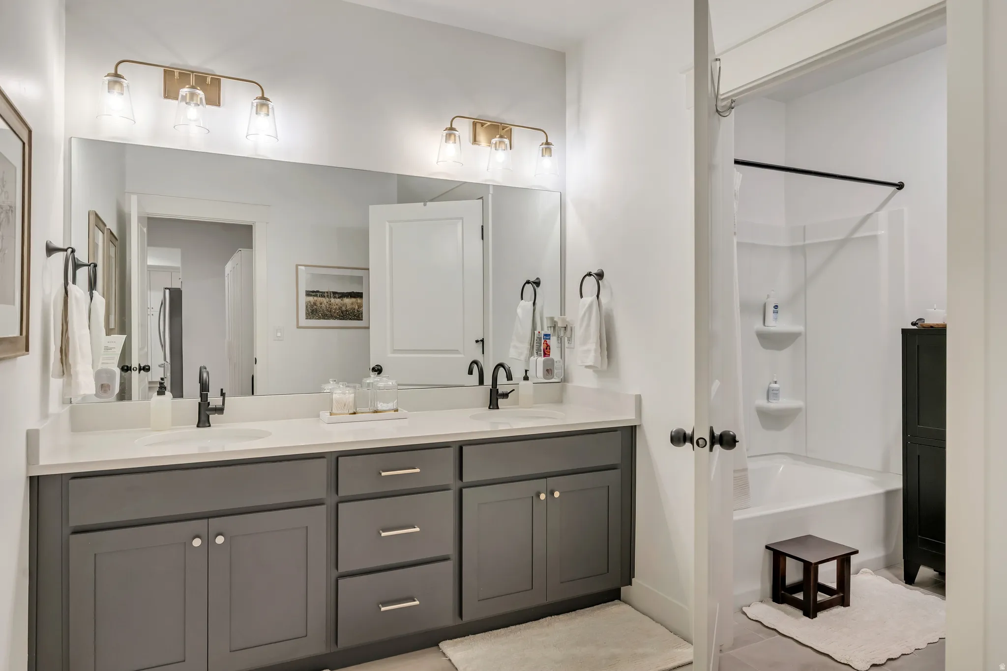 Mother in law Full bath featuring double vanity.