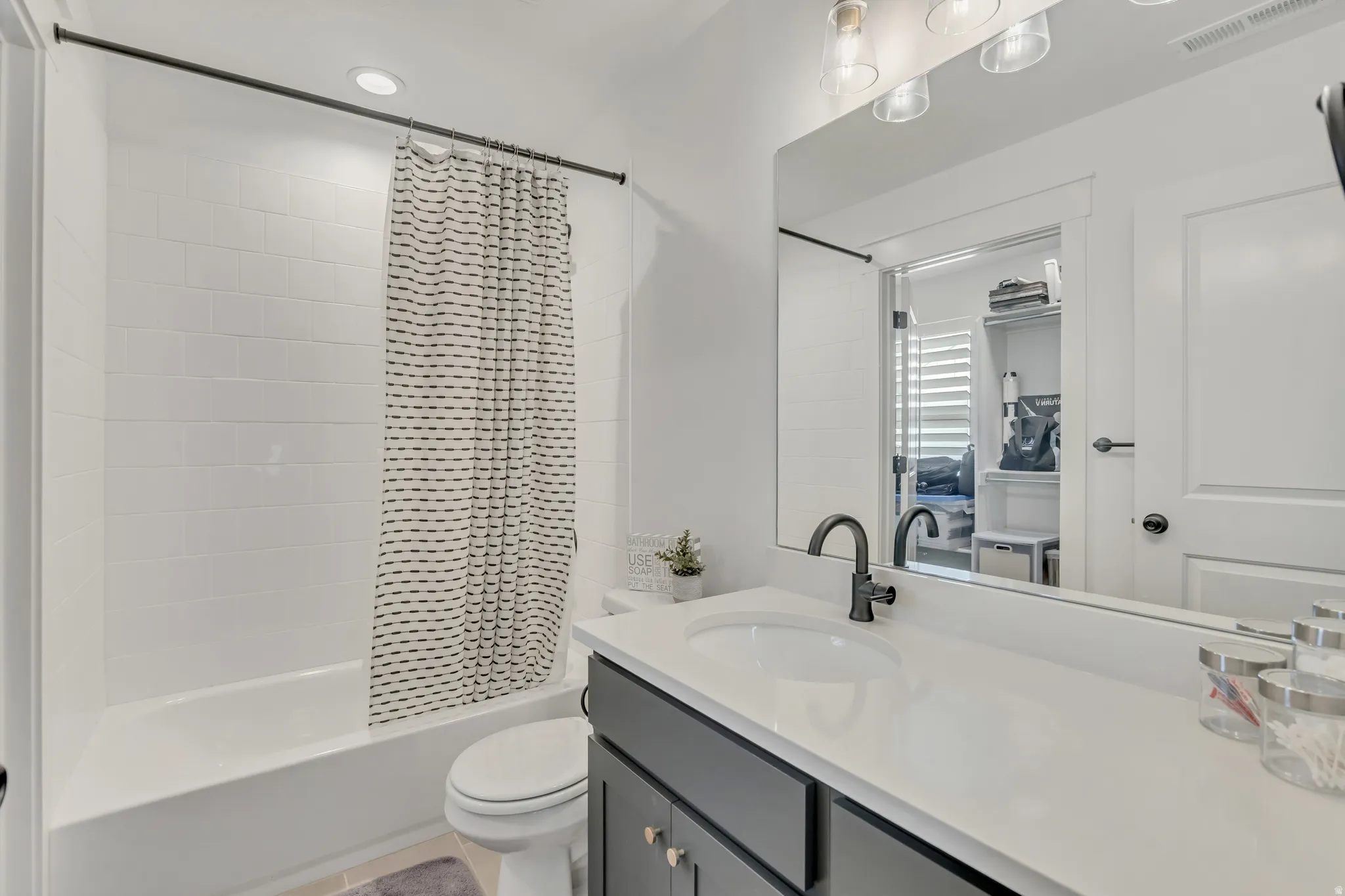 2nd bedroom private full bathroom with quartz countertops.