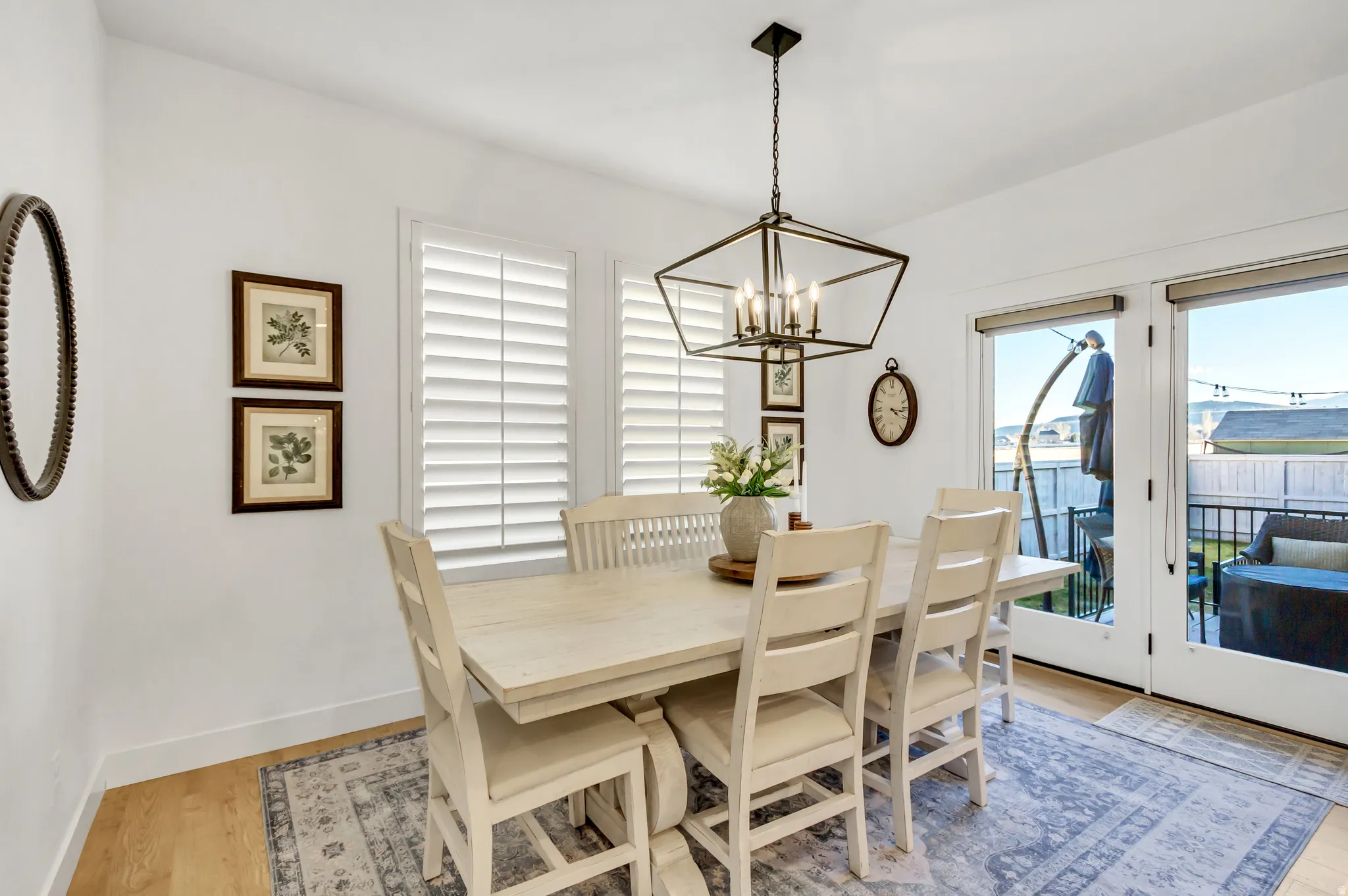 Dining Area with LVP flooring, natural light, plantation shutters.
