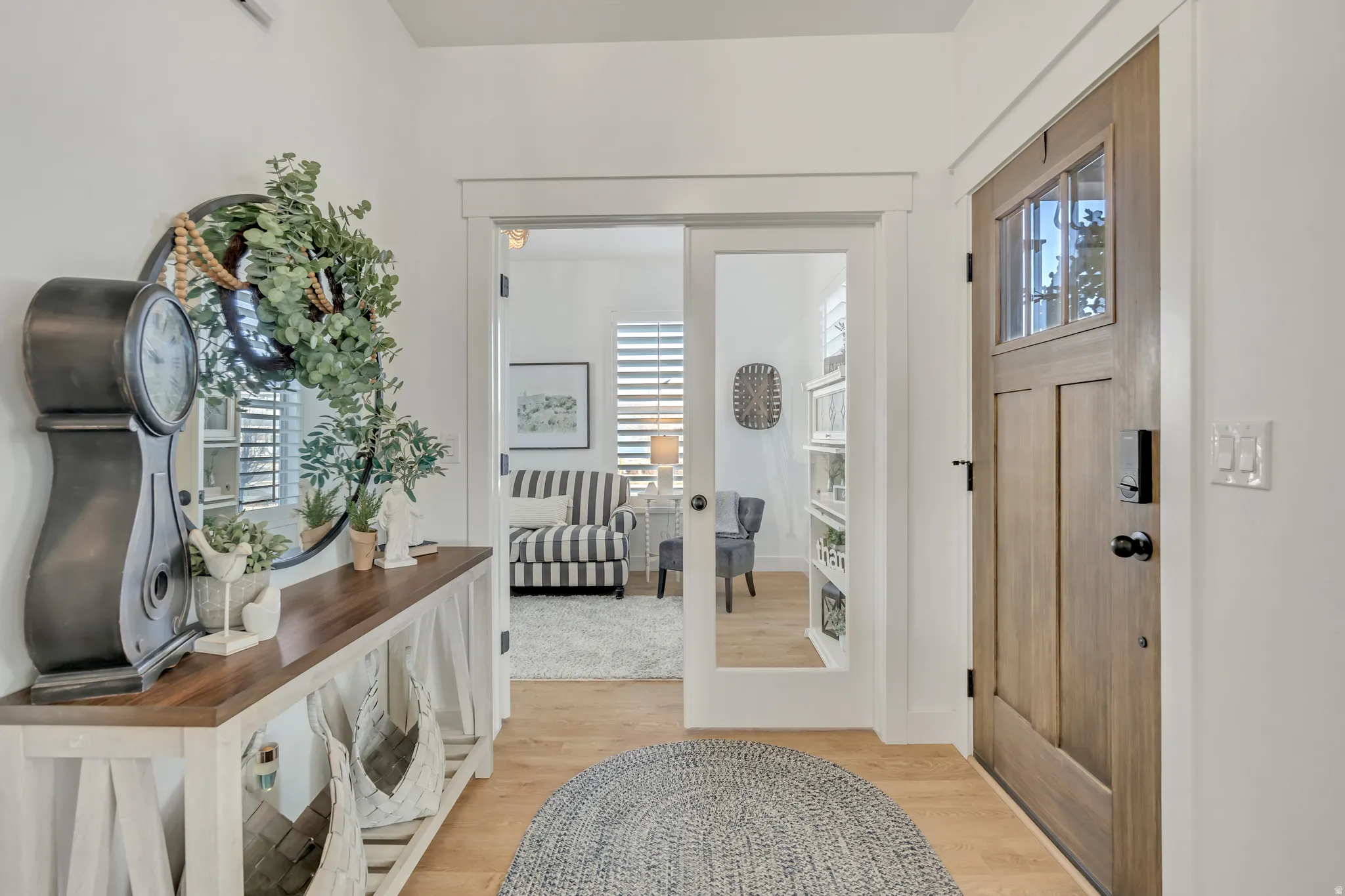 Entry way with french doors to office, LVP flooring.