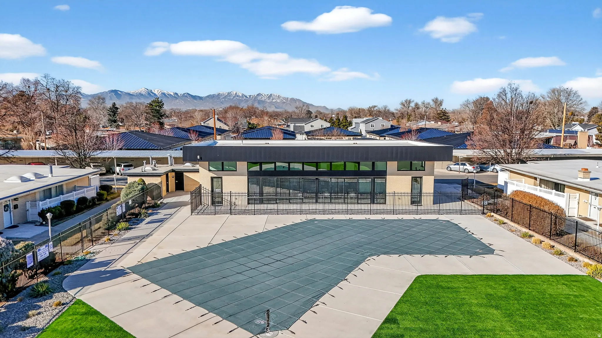 View of swimming pool with a residential view, a patio area, and a mountain view