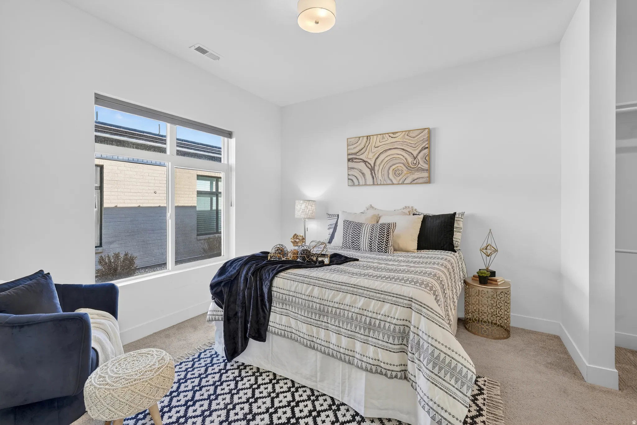 Bedroom with light carpet