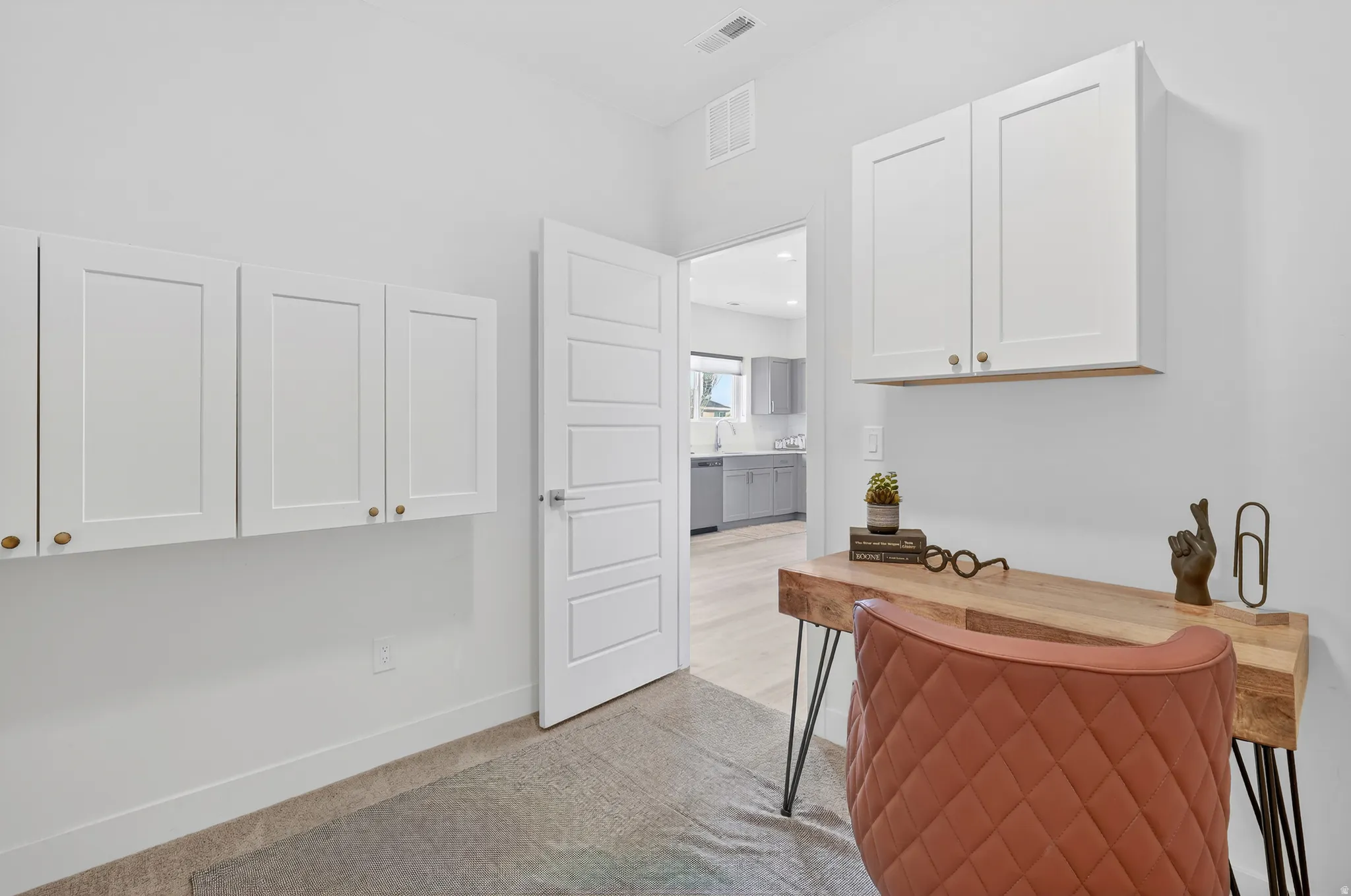 Kitchen with white cabinetry and dishwasher