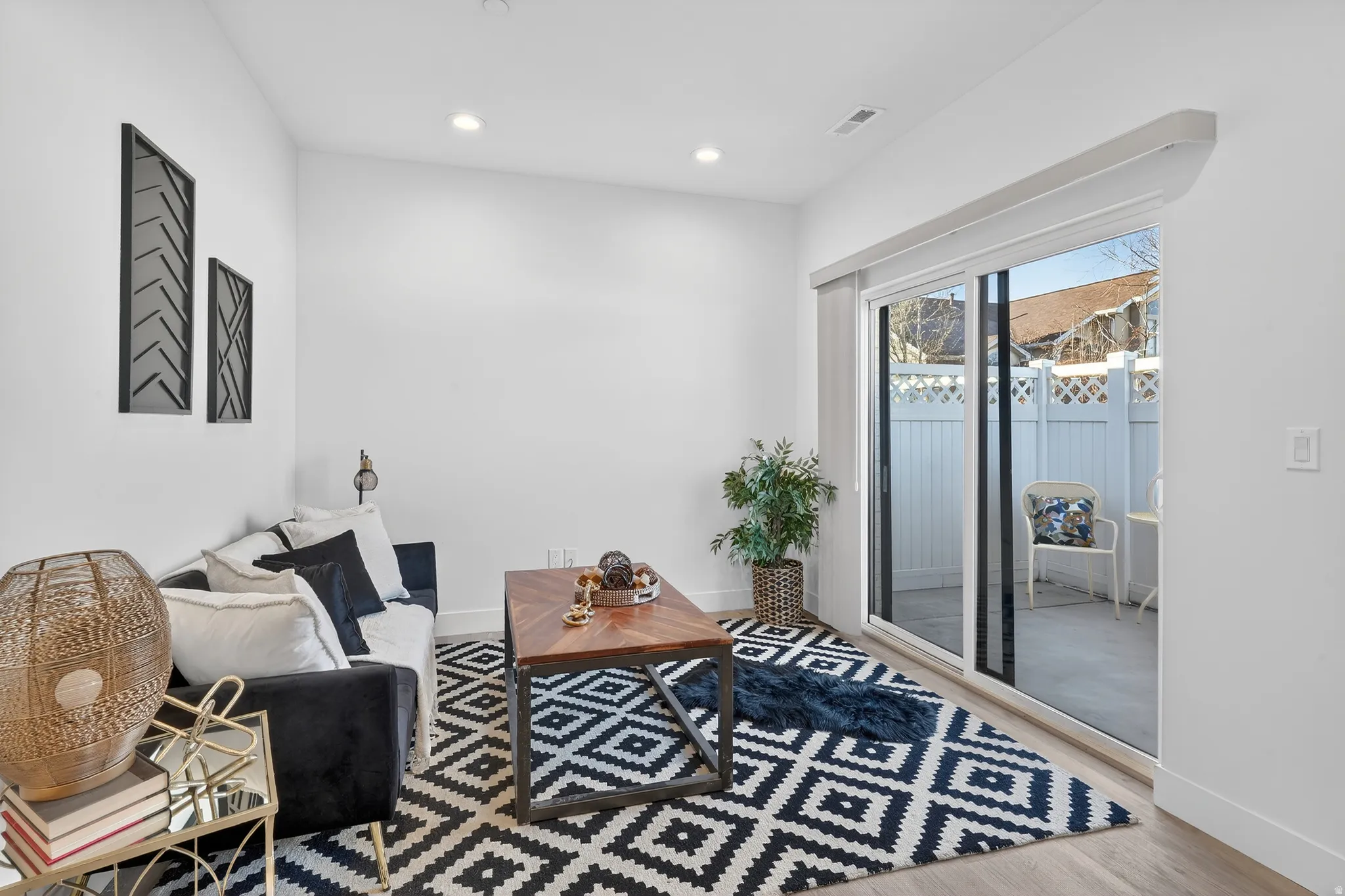 Sitting room with recessed lighting and light wood finished floors