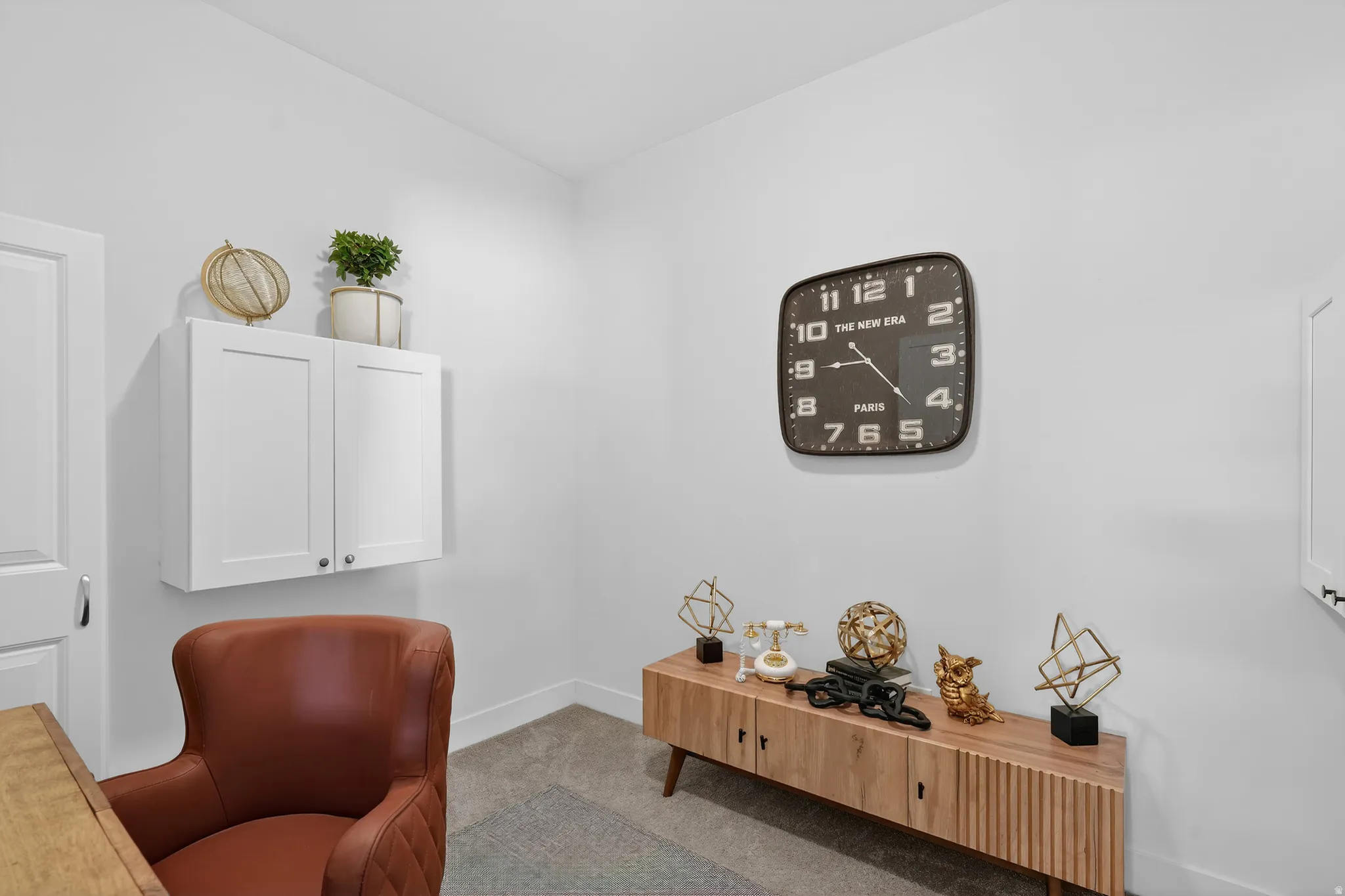 Carpeted home office with baseboards