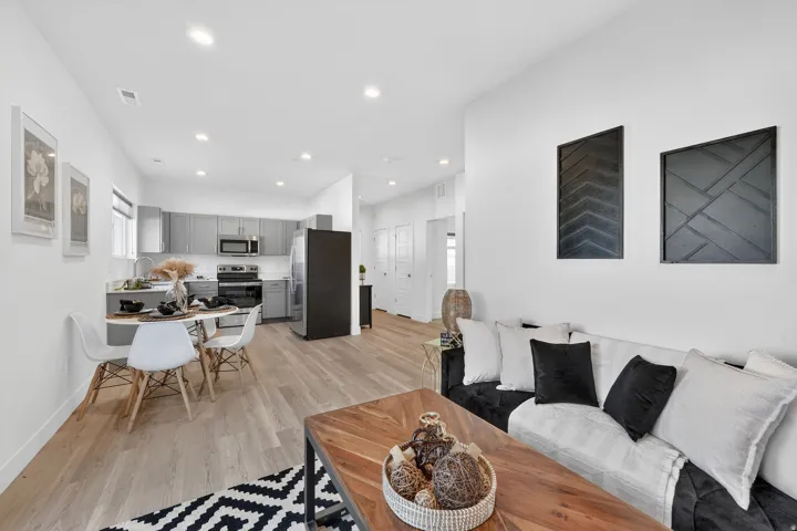 Living area featuring light wood-style floors and recessed lighting