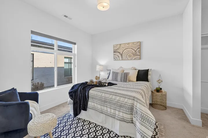 Bedroom with light carpet