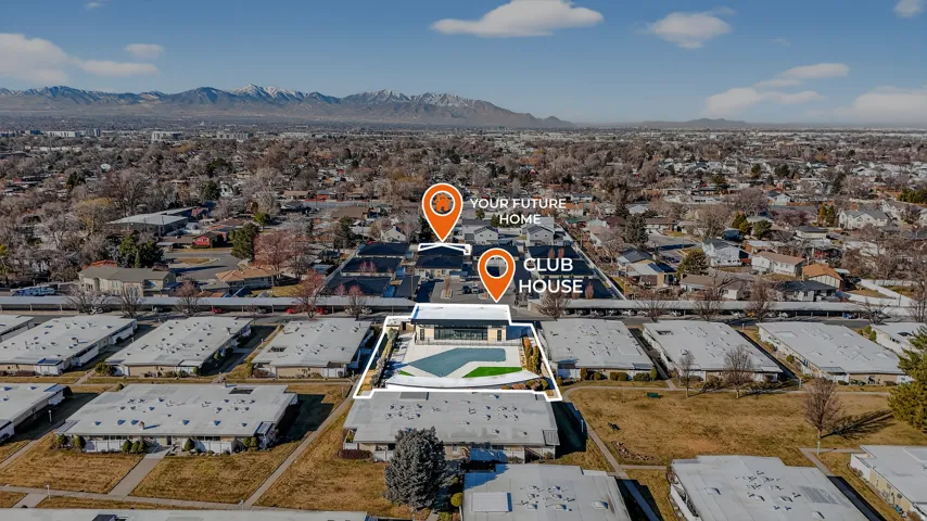Aerial view of property's location with a mountainous background and nearby suburban area