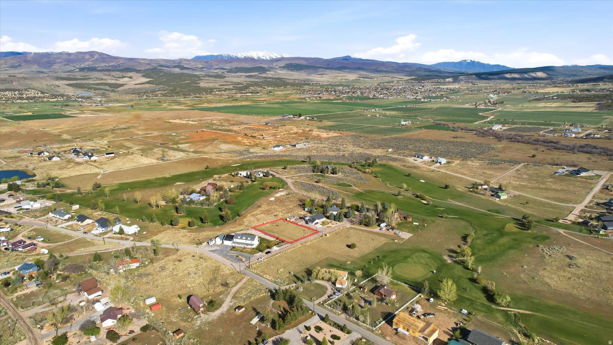 Expansive land parcel outlined in red, featuring a flat, open topography