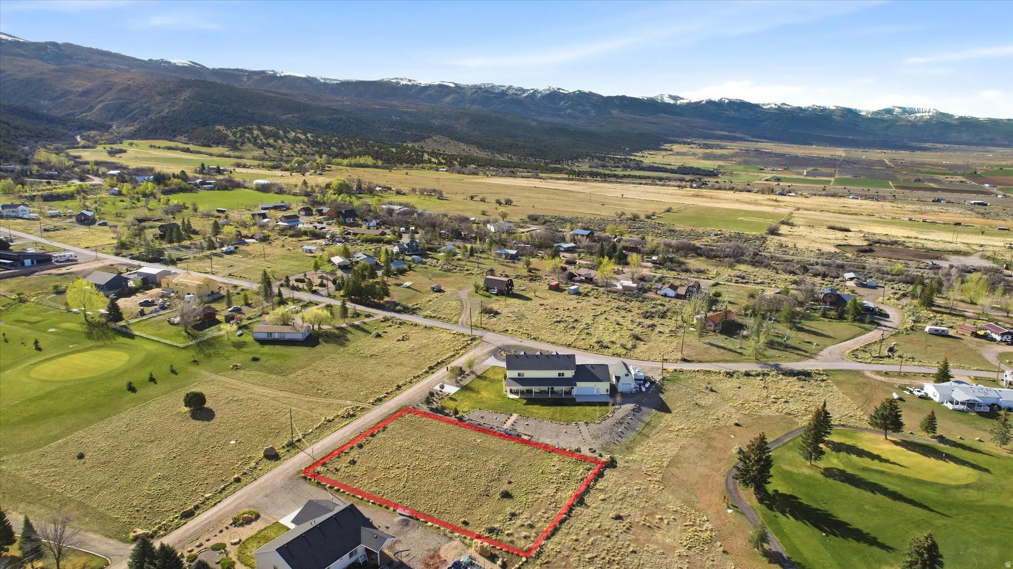 Expansive building lot featuring natural landscaping and mountain scenery