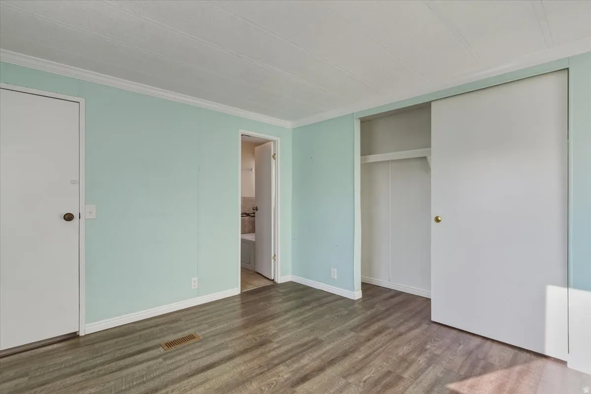 Spacious and serene, this primary suite offers plenty of room for a full bedroom set plus additional storage, making it a comfortable haven for rest.