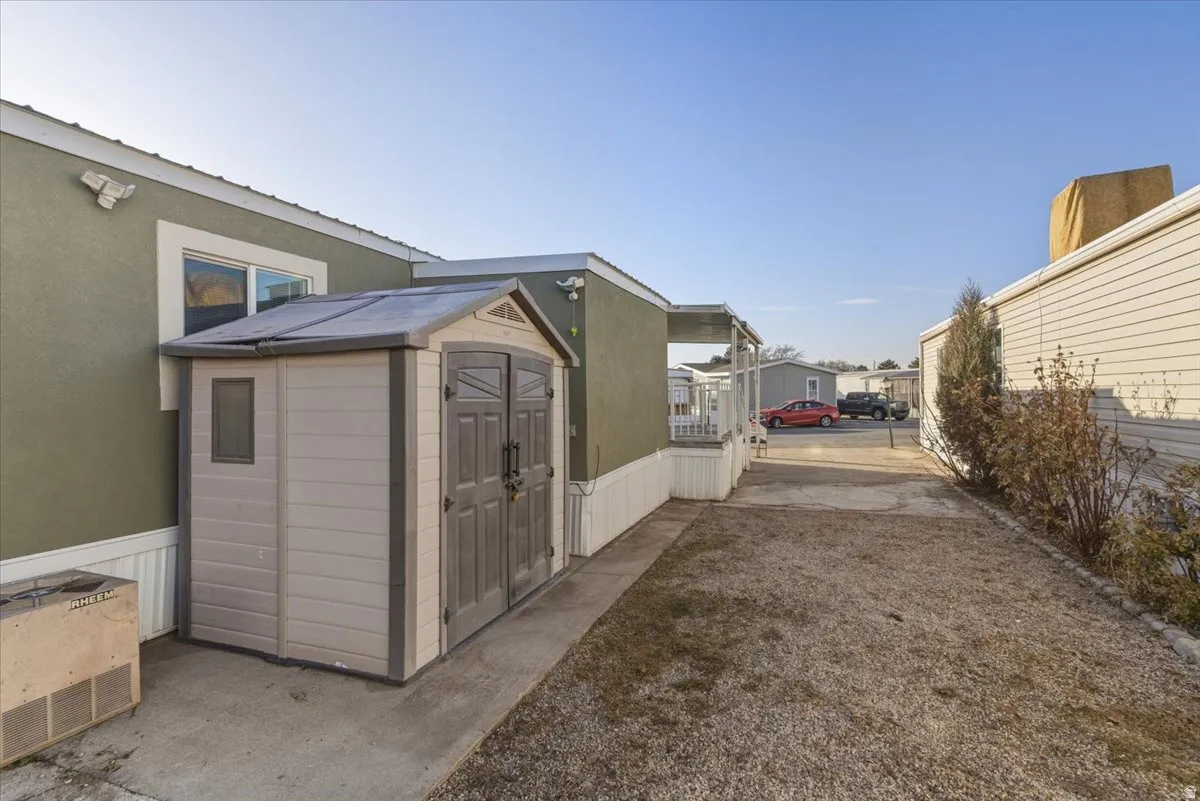 The property includes a large storage shed for added convenience, along with generous side parking that can accommodate multiple vehicles.