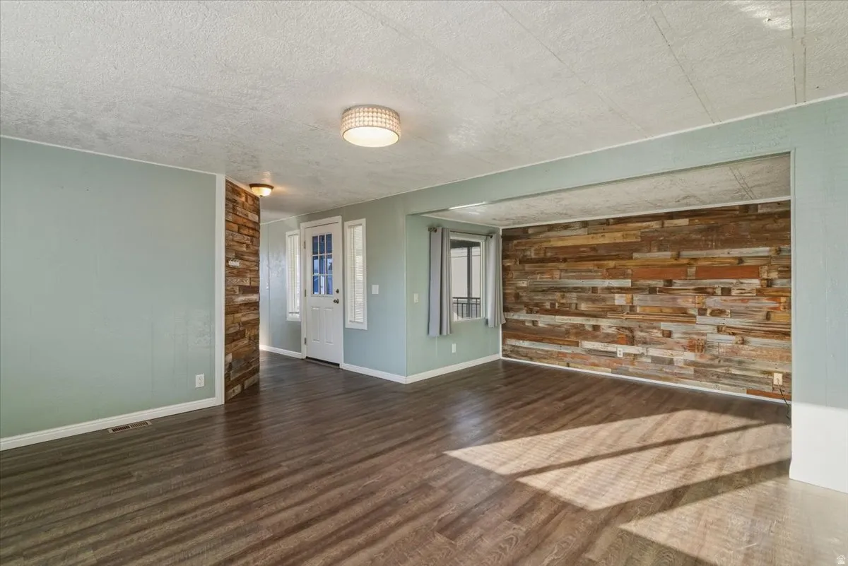 A sprawling, light-filled living area designed for modern multi-tasking. With enough square footage to house a full entertainment center and a dedicated home office nook, this is the true heart of the home.