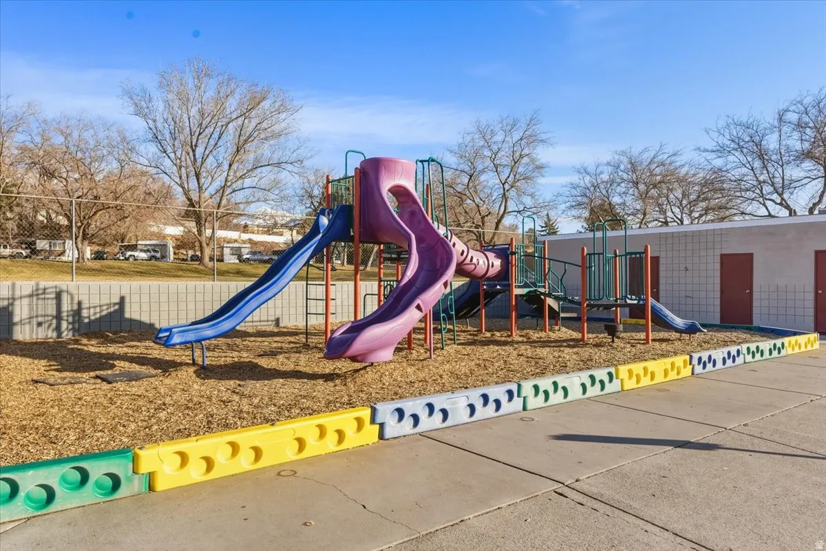 Enjoy a community park and playground located just steps away, offering easy access to outdoor recreation and green space within the Village Green Mobile Home Park.