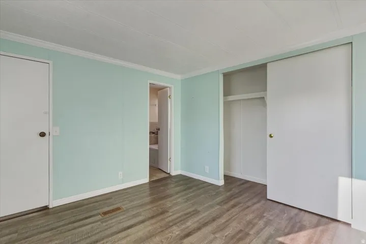 Spacious and serene, this primary suite offers plenty of room for a full bedroom set plus additional storage, making it a comfortable haven for rest.