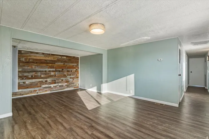 A sprawling, light-filled living area designed for modern multi-tasking. With enough square footage to house a full entertainment center and a dedicated home office nook, this is the true heart of the home.