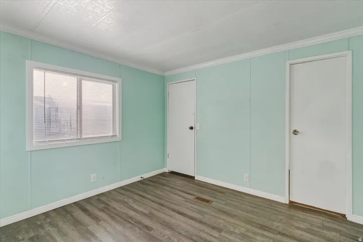 Spacious and serene, this primary suite offers plenty of room for a full bedroom set plus additional storage, making it a comfortable haven for rest.