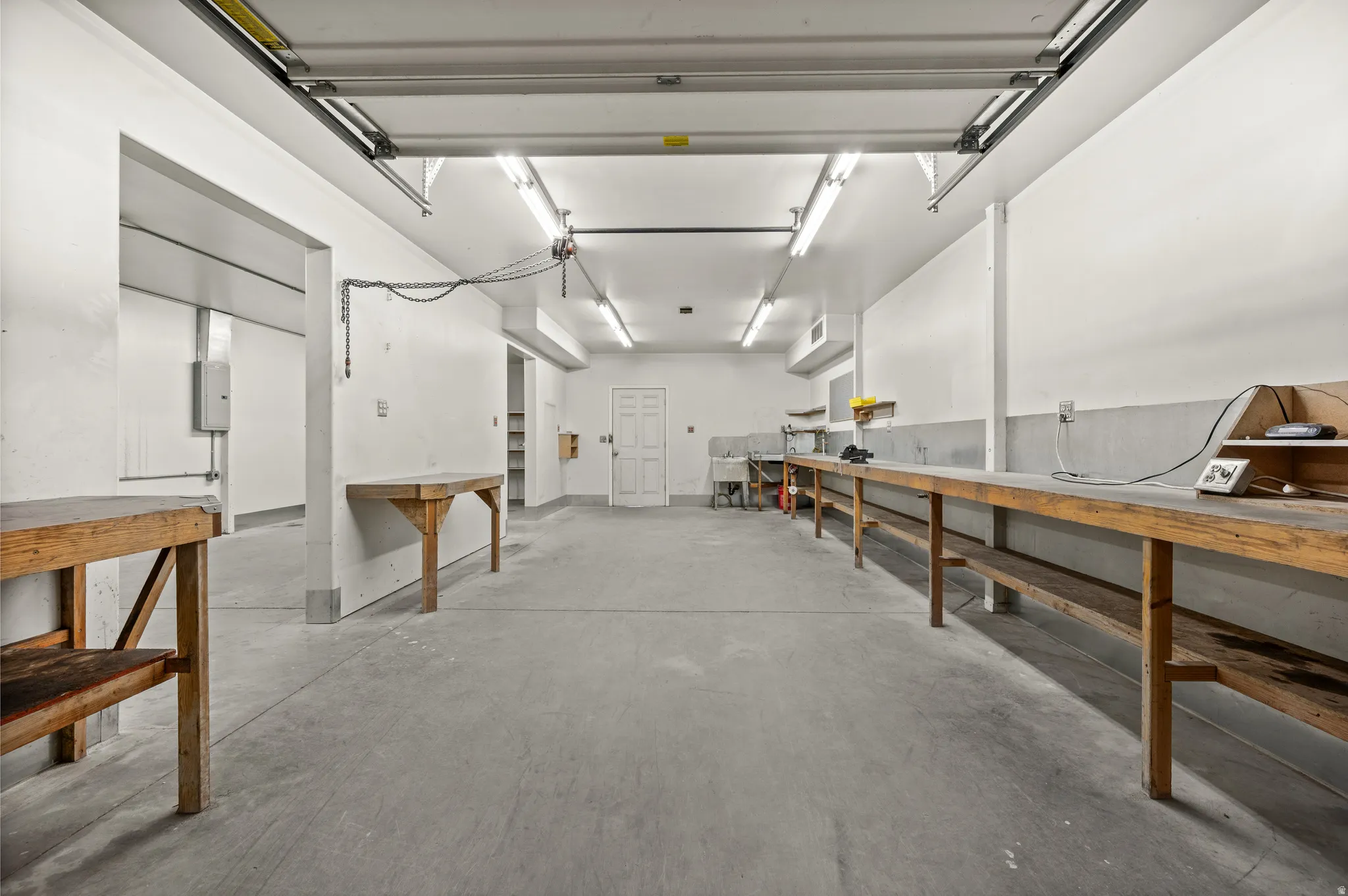 Misc room featuring concrete floors and a garage