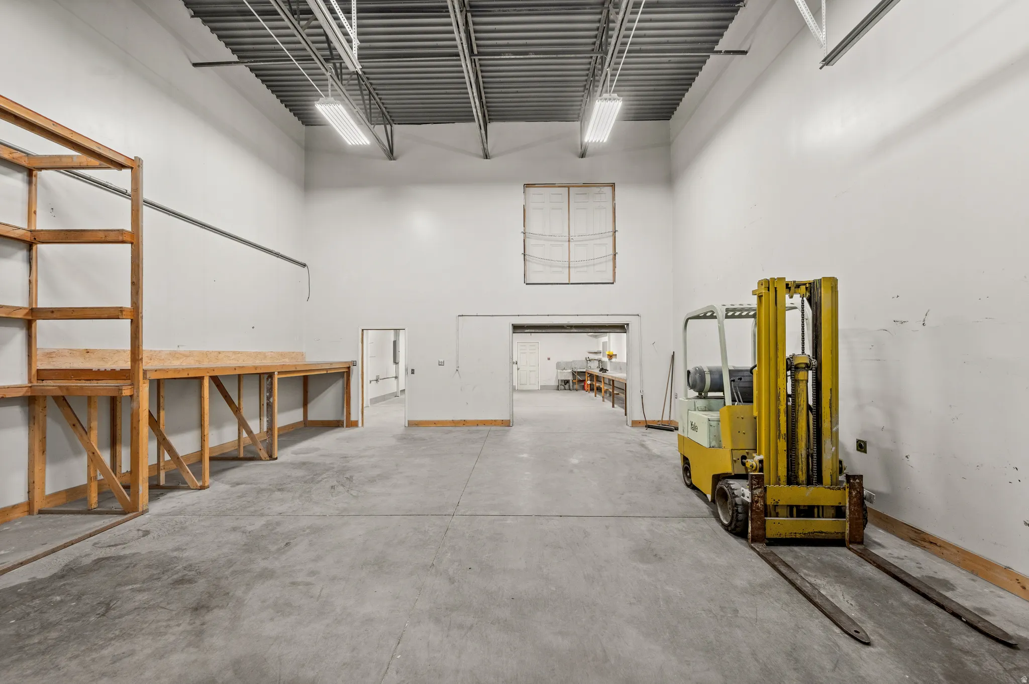 Garage featuring baseboards