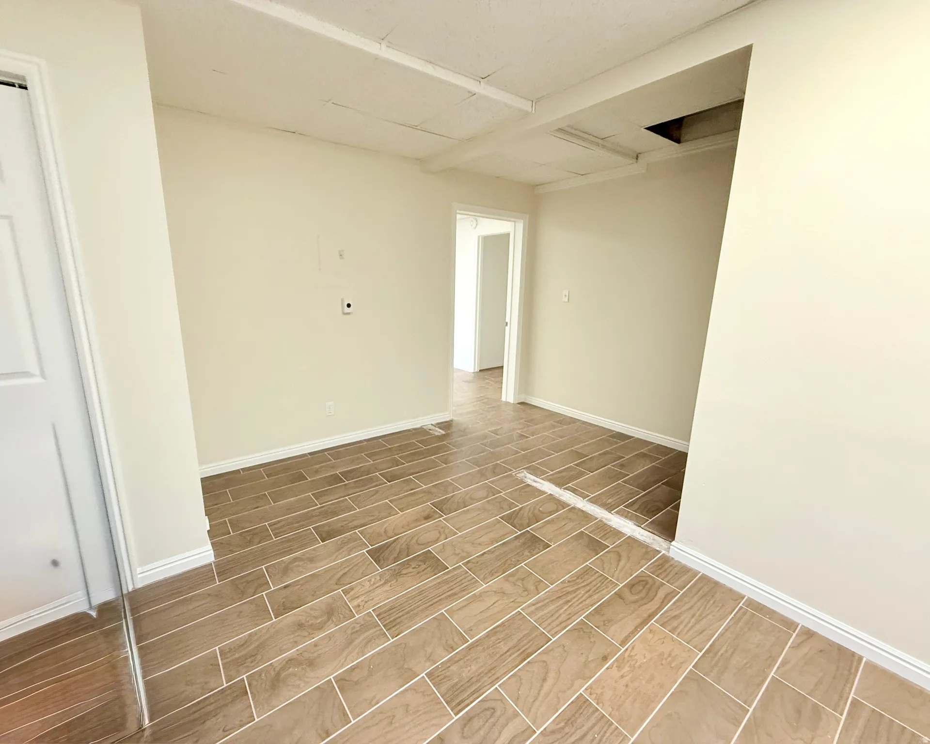 Spare room with wood finish floors and baseboards