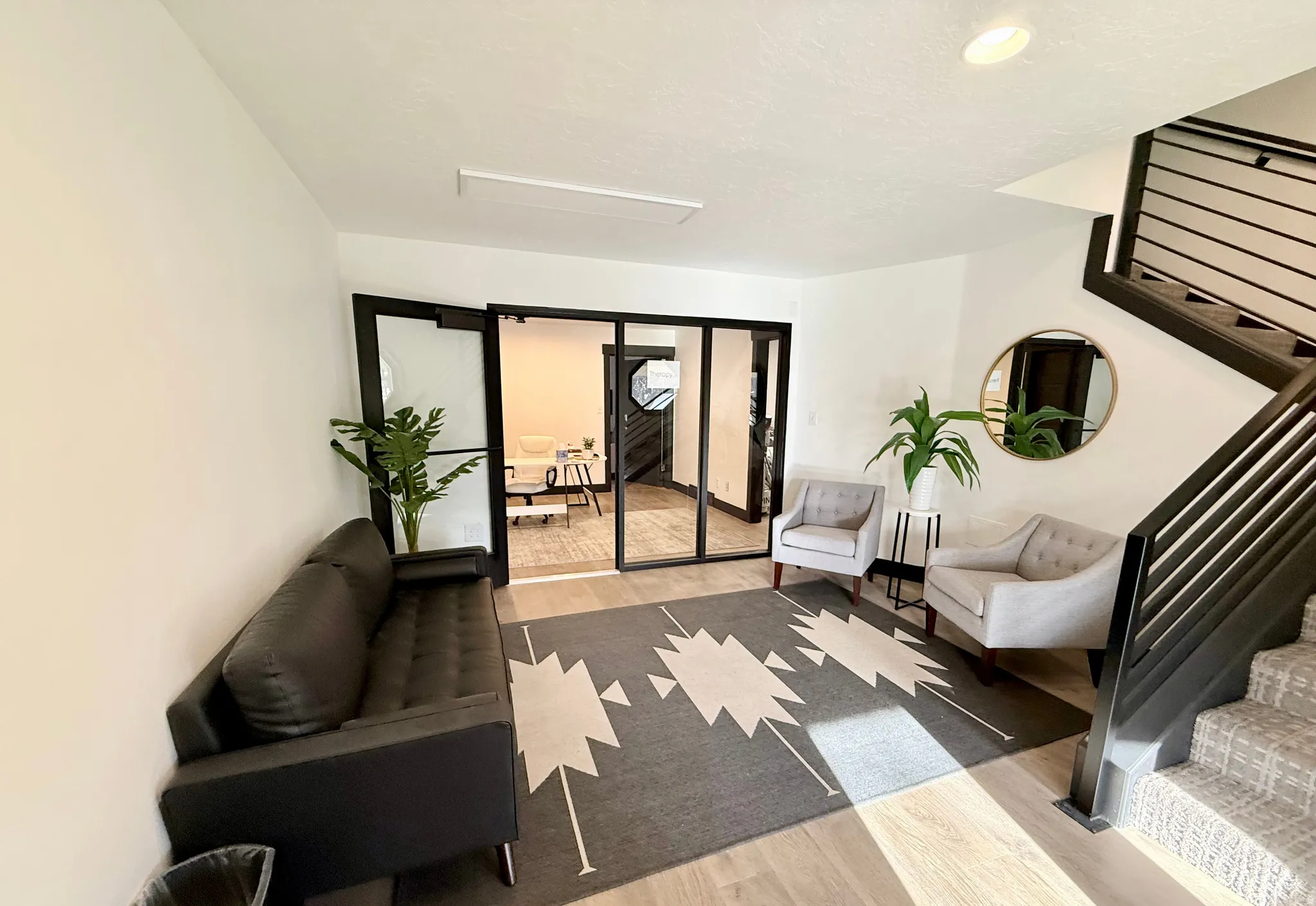 Living room with light wood-style floors and recessed lighting
