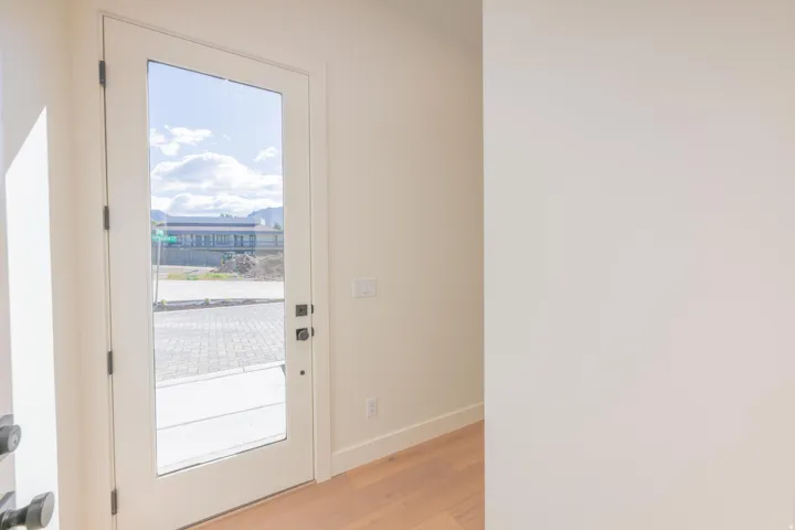 Entryway with wood finished floors and a mountain view