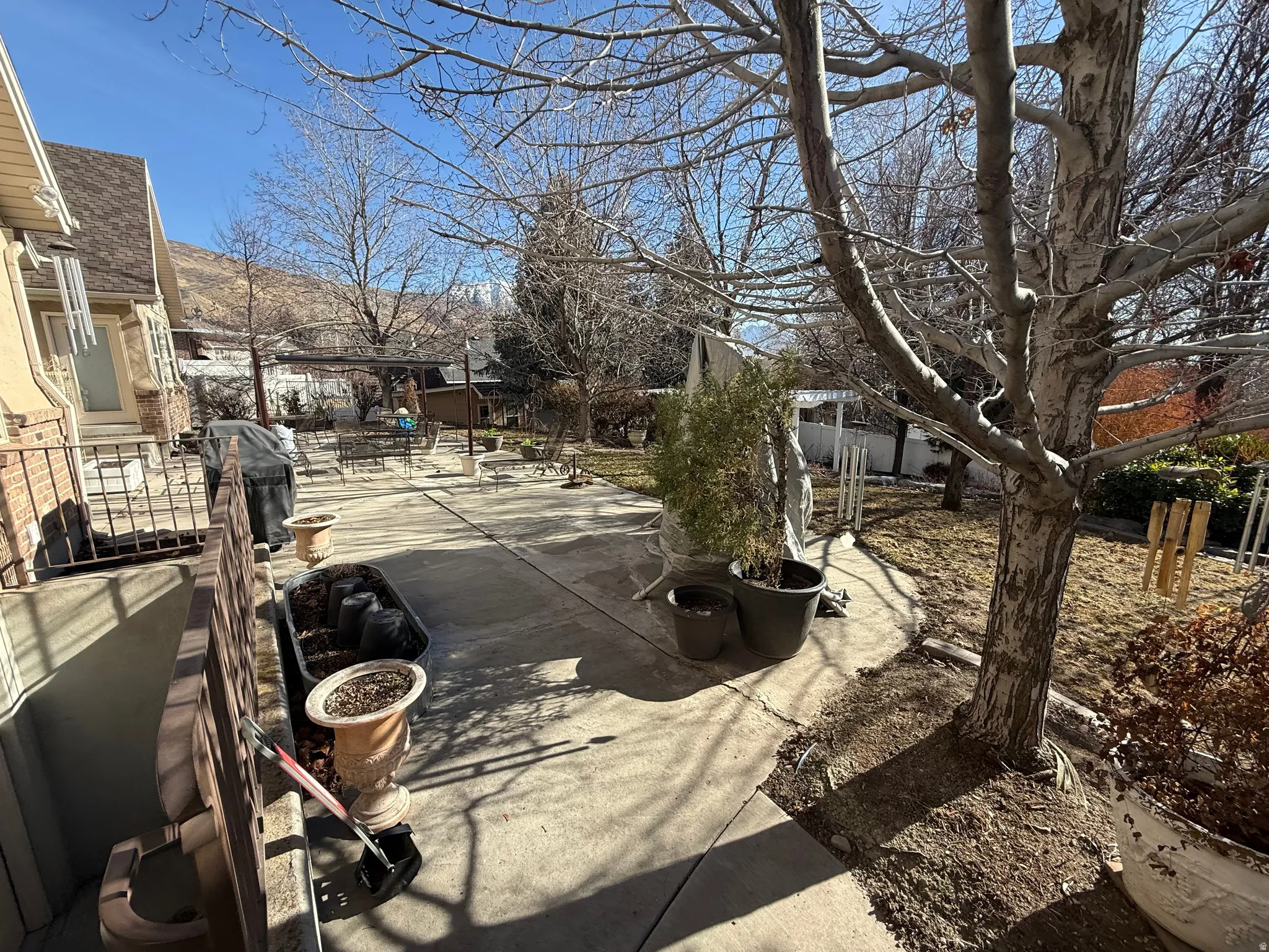 Fenced backyard with a patio area