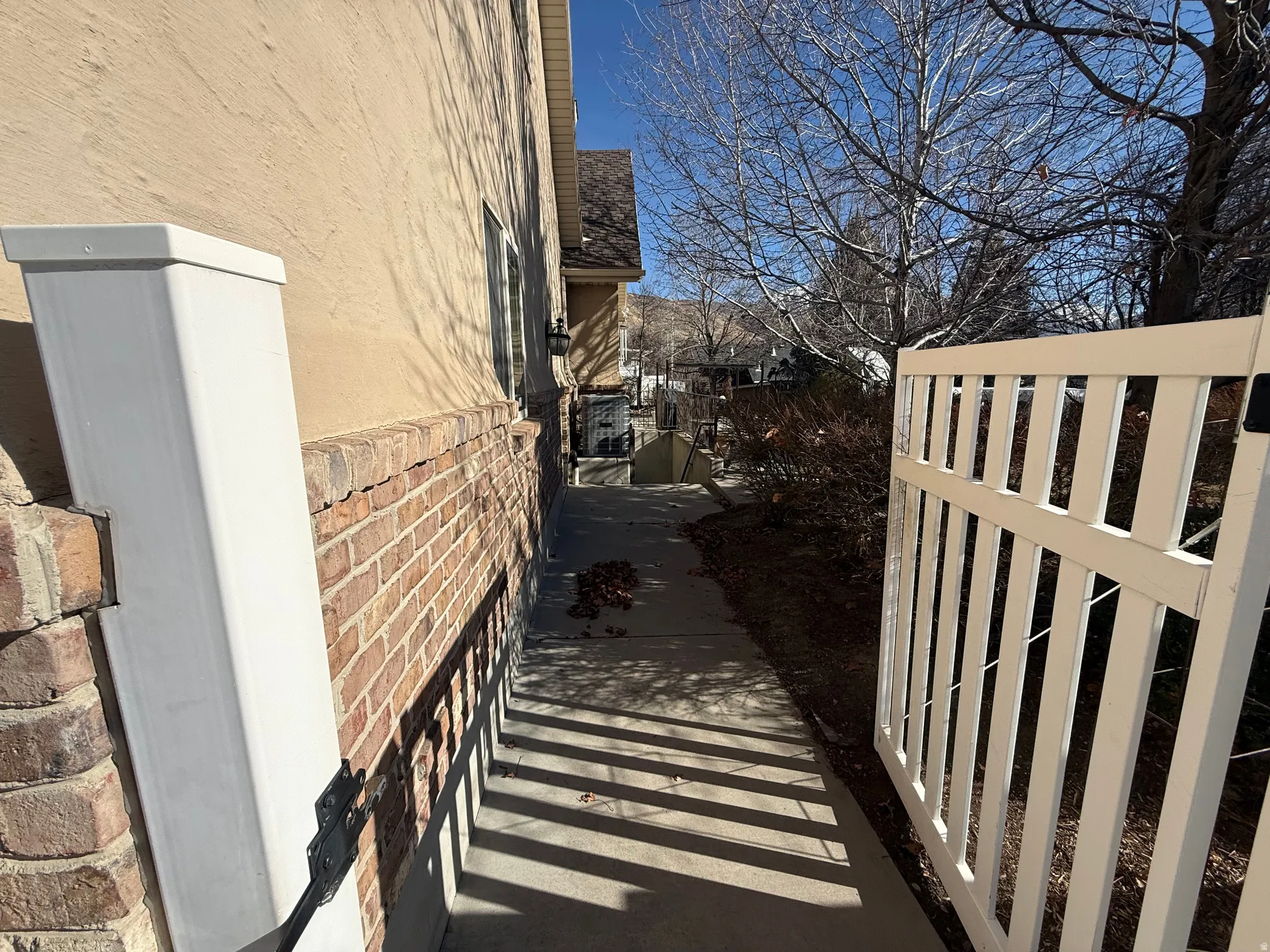View of property exterior featuring brick siding
