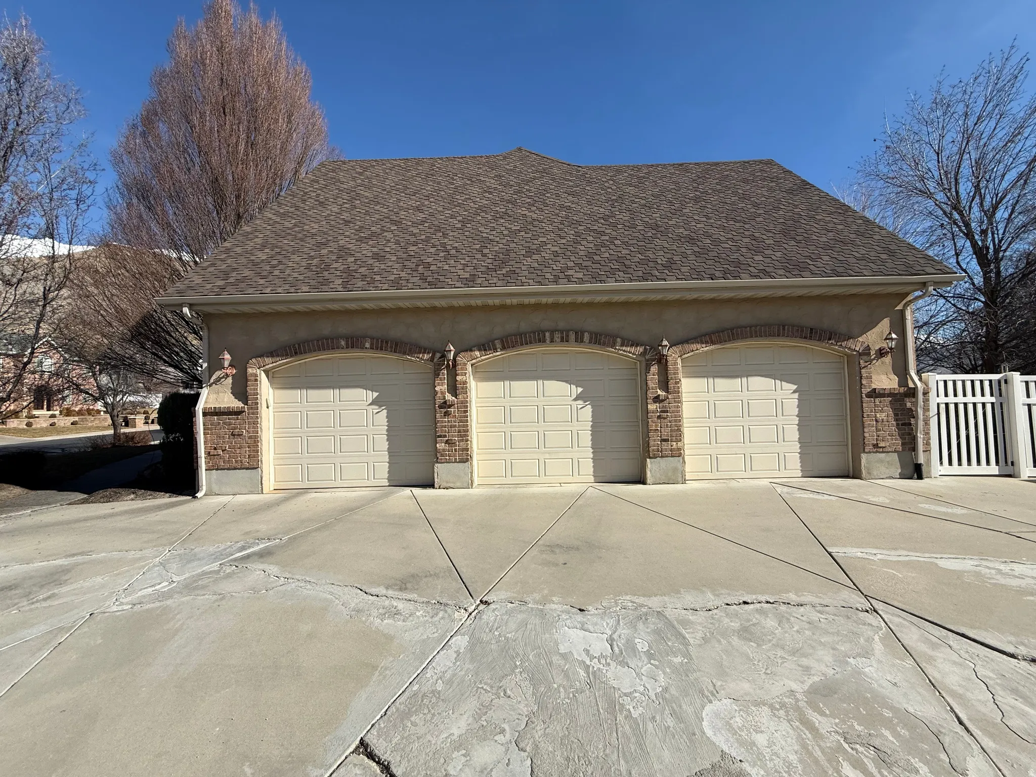 Garage featuring concrete driveway