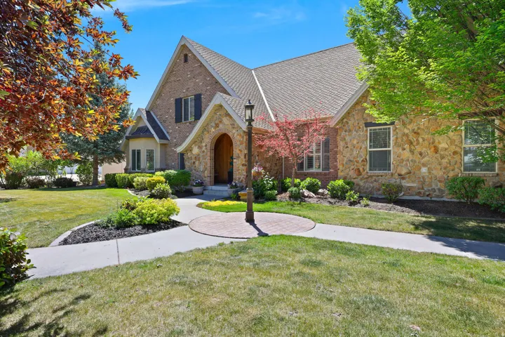 Stately brick and stone exterior with arched entryway