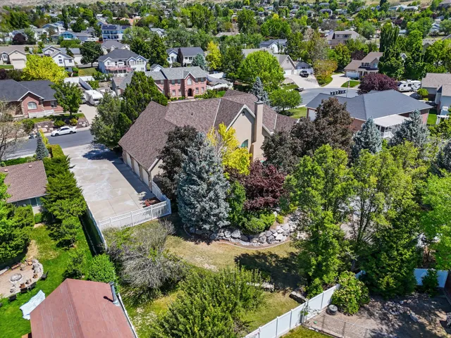 Two-story residence with a stucco exterior and multi-gabled roofline