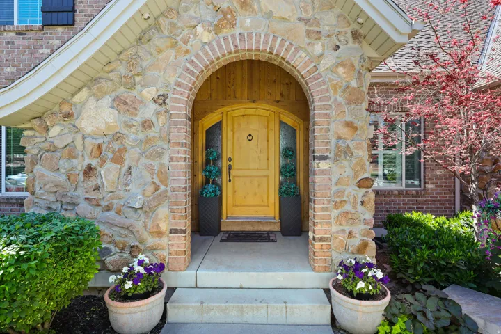 Stone and brick facade with an arched entryway