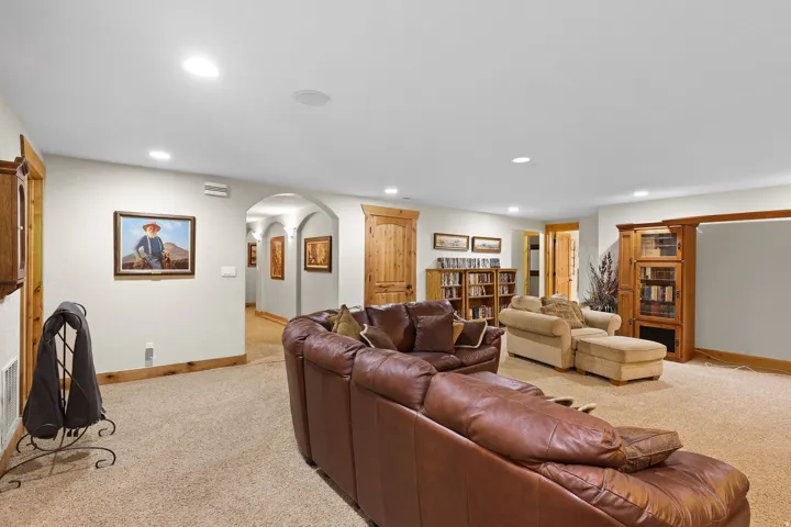Spacious interior featuring recessed lighting, archways, and warm wood trim