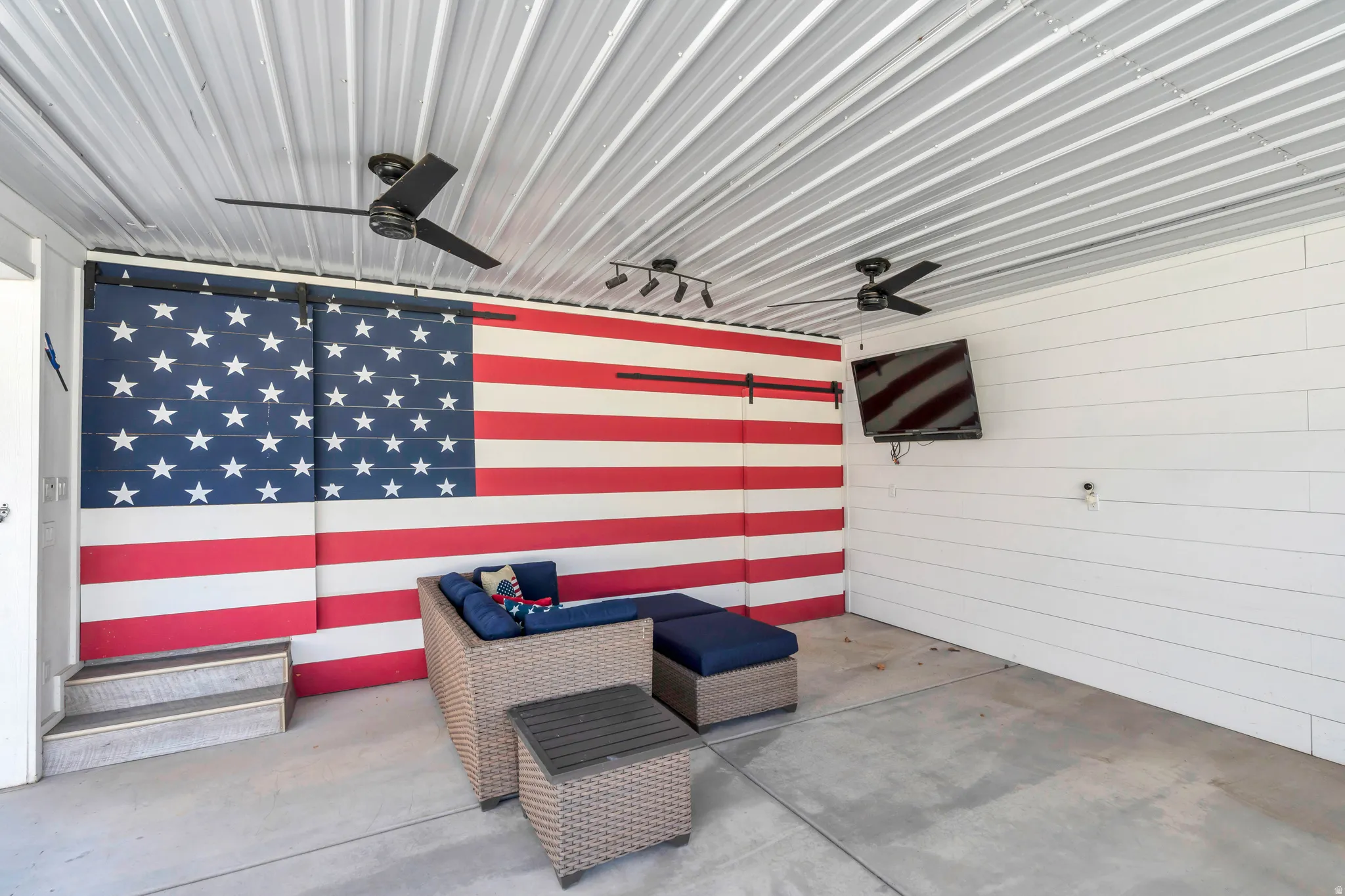 View of patio featuring a ceiling fan