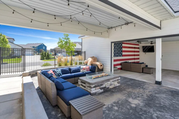 View of patio / terrace featuring an outdoor living space with a fire pit