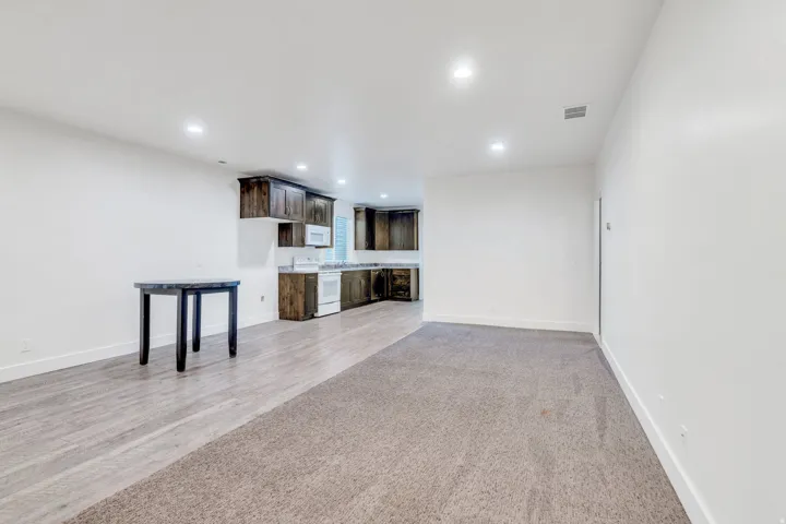 Unfurnished living room featuring recessed lighting and light wood-style floors