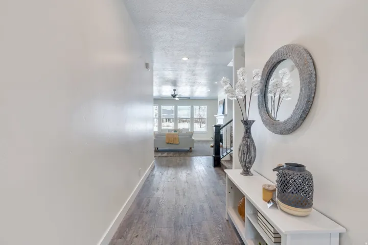 Hall with dark wood-style floors and a textured ceiling