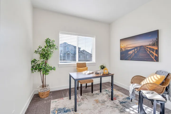 Carpeted office with baseboards