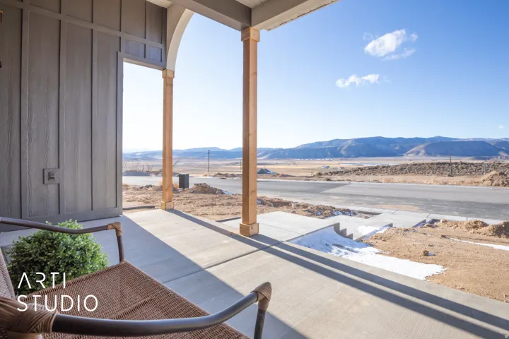 Sunroom with a mountain view
