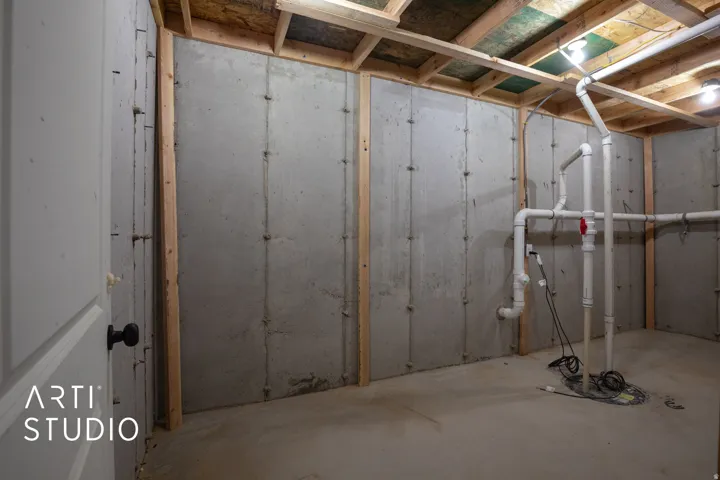 Unfinished basement with ejector pump