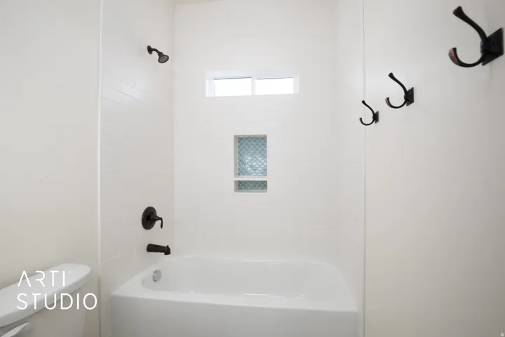 Full bathroom with shower / bath combination and toilet
