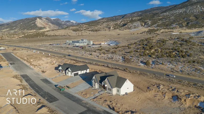 Aerial view of property and surrounding area featuring mountains