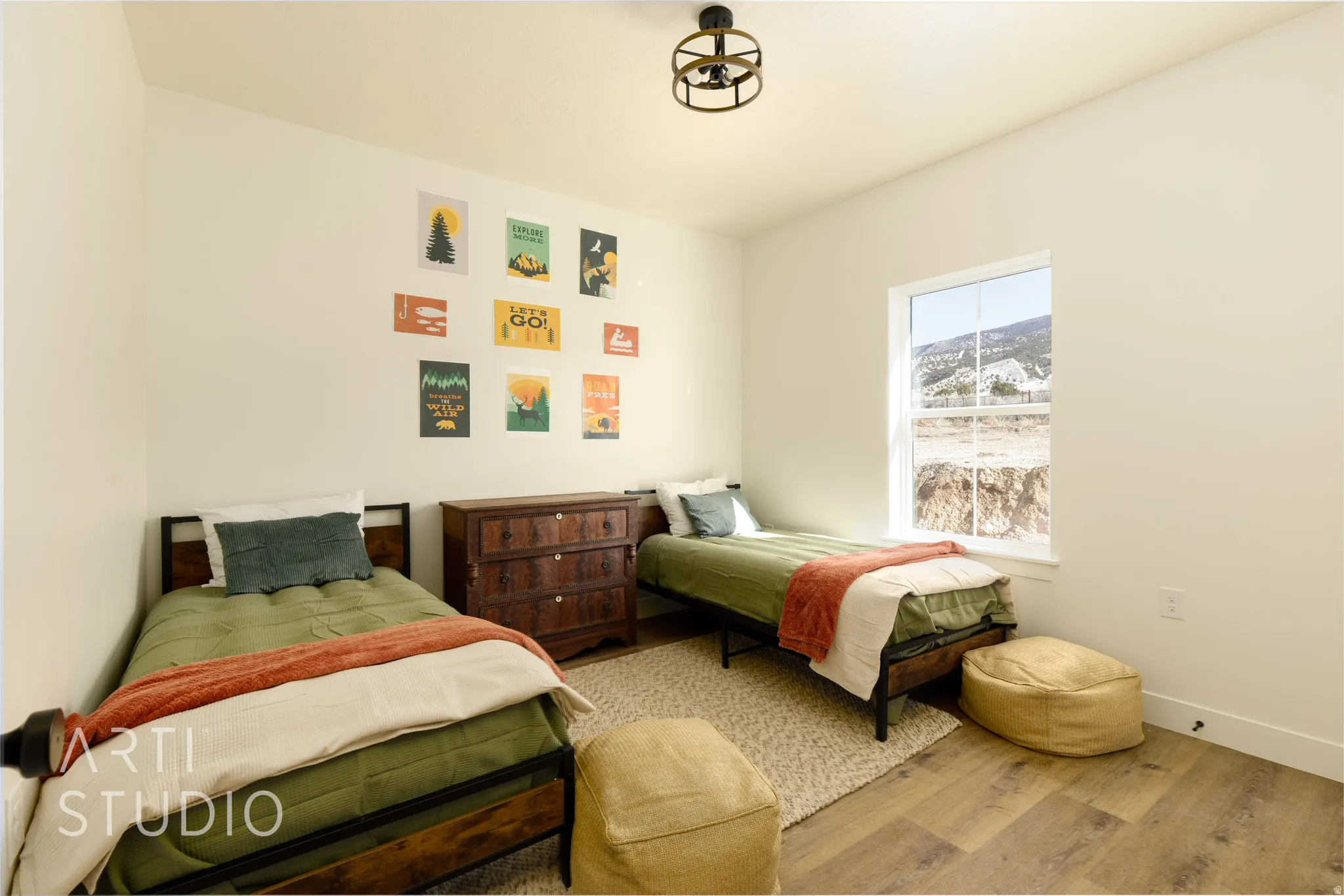 Bedroom featuring wood finished floors and baseboards