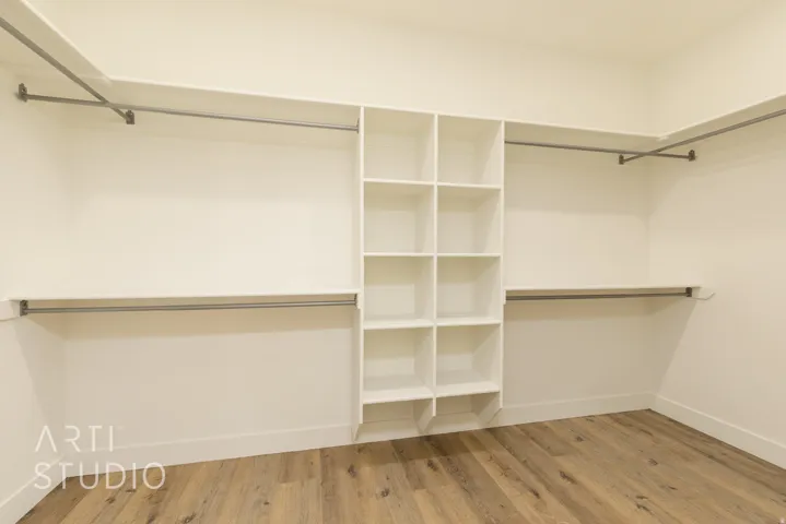 Walk in closet featuring light wood-style floors