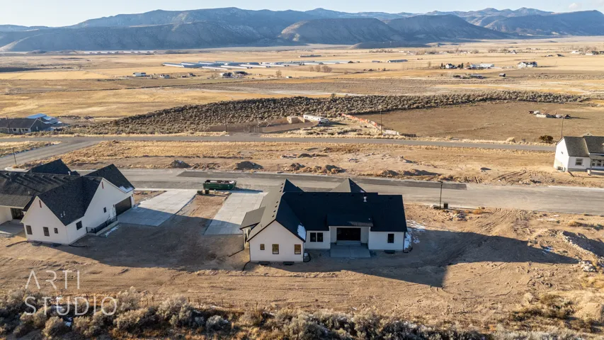 View of rural area featuring mountains and a desert landscape